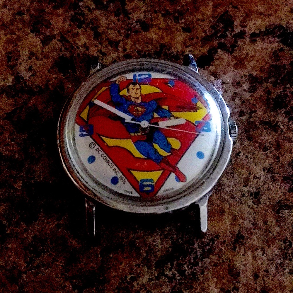 1976 Dc comic  mechanical  whind up watch still tics.  Is not. Faded